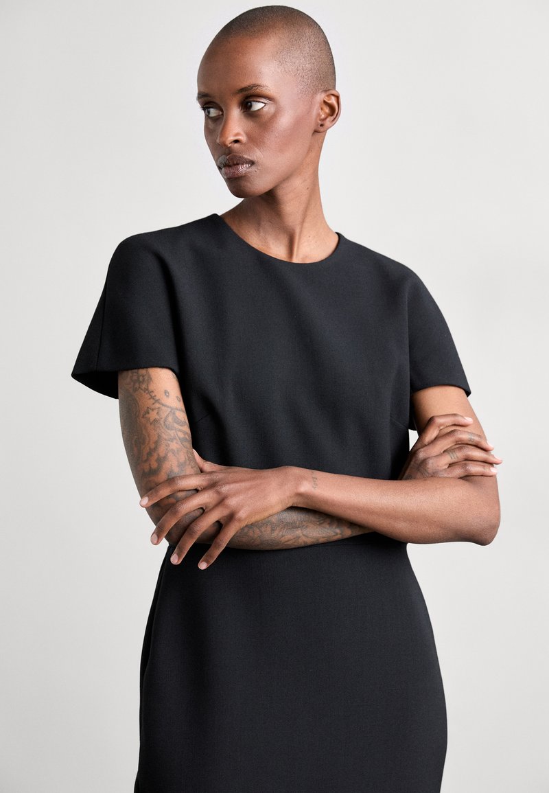 slim fit dress slacks Fitted T-Shirt Dress In Ivory – Victoria Beckham UK main image 1