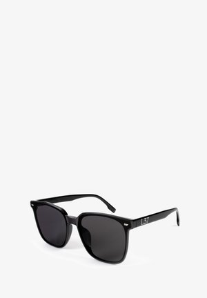 Black sunglasses with a square frame, dark tinted lenses, smooth plastic finish, and a silver "L37" accent on the side.