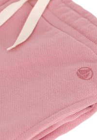 Rosa Baumwollshorts mit strukturierter Oberfläche und einem weißen Kordelzug. Mit kleinem, geprägtem Logo in der unteren rechten Ecke.