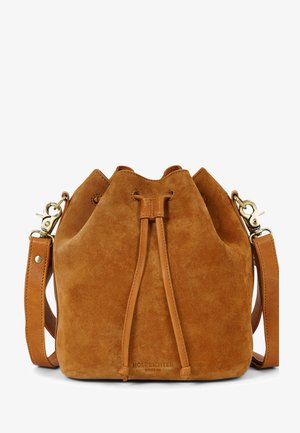 Brown suede bucket bag with a drawstring closure, two leather straps, and brass hardware accents. Smooth texture and minimalist design.
