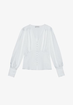 Blusa blanca con mangas largas abullonadas, escote en V y cierre de botones en la parte delantera. Hecha de una suave tela de satén con un ligero brillo.