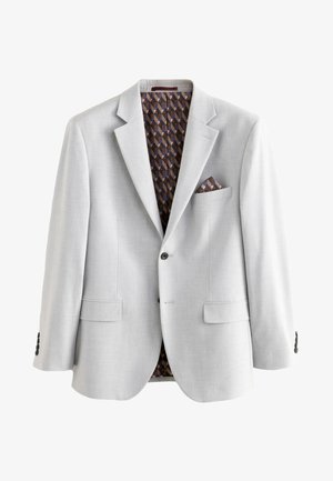 Jasnoszara marynarka męska na dwa guziki, wzorzysta brązowo-czarna podszewka oraz dopasowana poszetka w kieszeni na piersi.