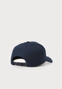 Navy blue baseball cap with a rounded crown, flat visor, and an adjustable plastic strap at the back. Made of textured fabric.