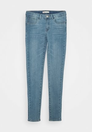 Blue denim jeans with a slim fit. Features a mid-rise waist, five pockets, and a button closure. The fabric has a smooth texture with a faded finish.