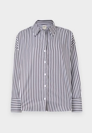 Prúžkovaná košeľa na gombíky so zvislými čiernymi a bielymi pruhmi, golierom, dlhými rukávmi a gombíkovými manžetami. Hladký bavlnený materiál.