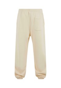 Beige sweatpants med elastisk talje, ribbede ankler og en enkelt baglomme. Blødt, blandet bomuldsstof med en glat tekstur.