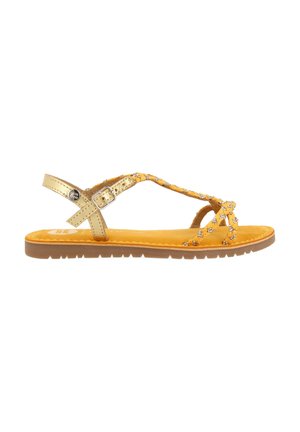 Sandalía de cuero amarilla con acentos dorados, que presenta tiras entrelazadas y una suela plana. Decorada con rhinestones para un detalle adicional.