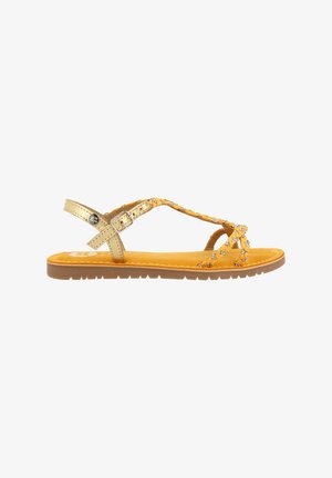 Sandal in pelle gialla con accenti dorati, dotato di cinturini incrociati e suola piatta. Decorato con strass per un tocco in più.