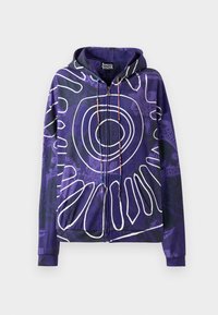 Felpa zip con cappuccio viola caratterizzata da un grande motivo circolare bianco, tasche frontali e accenti di cordoncino con perline. Tessuto dalla finitura liscia.