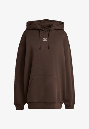Hnedá mikina s kapucňou, vo voľnom strihu a s vreckom "klokan". Na hrudi sa nachádza biele logo adidas a manžety sú rebrované. Mäkký materiál.