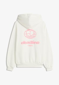 Sweat à capuche blanc avec un grand graphique rose d'un globe avec un design de cœur et le mot "deadline" en dessous. Matériau doux, coupe décontractée.