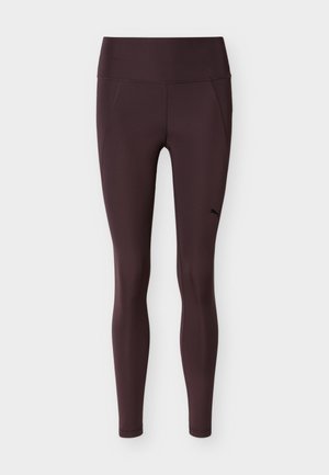 Σκούρο μωβ αθλητικό κολάν με ψηλή μέση και λεπτή εφαρμογή, με ένα μικρό μαύρο λογότυπο Puma στην πάνω αριστερή πλευρά του μηρού.