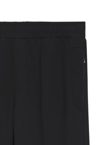 Pantalon noir avec ceinture élastique, détails de coutures verticales et une poche latérale à droite.