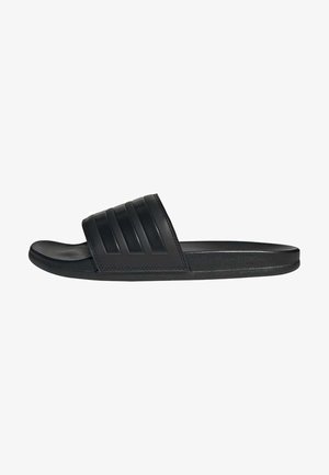 Black slide sandals made of smooth rubber. Features a wide strap with three horizontal grooves. Flat sole with a rounded toe.
