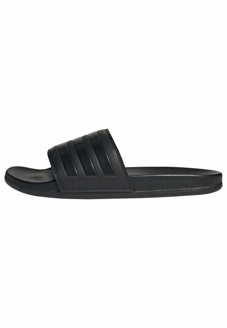 Black slide sandals made of smooth rubber. Features a wide strap with three horizontal grooves. Flat sole with a rounded toe.