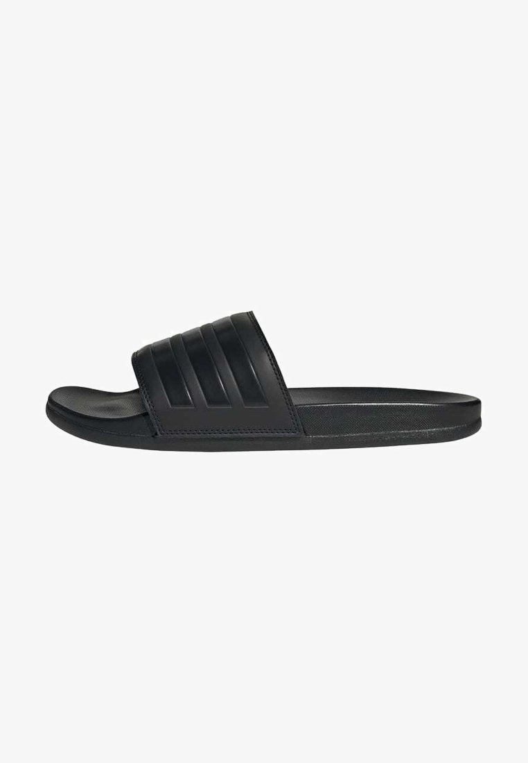 Black slide sandals made of smooth rubber. Features a wide strap with three horizontal grooves. Flat sole with a rounded toe.