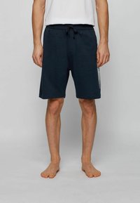 Námořnické modré šortky ze měkké bavlněné směsi, s elastickým pasem a šňůrkou na stažení, a s kostkovaným panelem jako akcentem na boku.