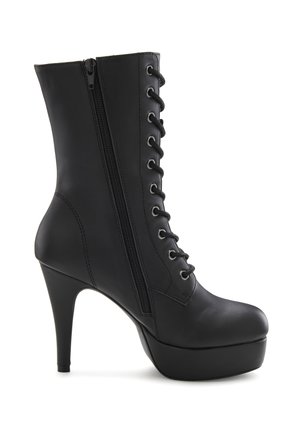 Black high-heeled ankle boot with a glossy finish, featuring both lace-up front and side zipper, round toe, and platform sole.