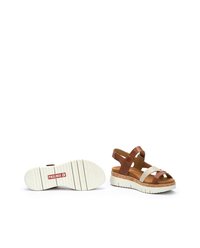 Sandali con tomaia in pelle marrone e sintetico beige, con fasce incrociate, sottopiede in sughero e suola in gomma bianca. Logo del marchio sulla suola.