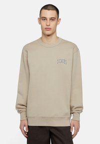 Sudadera beige hecha de una mezcla de algod�ón, con cuello redondo acanalado, mangas largas y un logo bordado en el lado izquierdo del pecho.