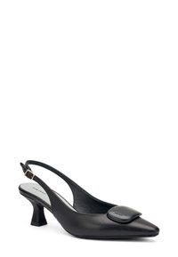 Décolleté in pelle nera con punta affusolata, tacco medio e un accento decorativo opaco nero sulla parte superiore. Texture liscia.