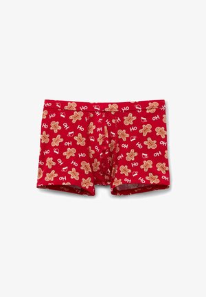 Rote Boxershorts mit einem Muster aus Lebkuchenmännchen und festlichen Sprüchen. Hergestellt aus weichem Stoff mit elastischem Bund.