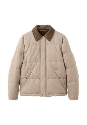 Beżowa pikowana kurtka z brązowym kołnierzem z sztruksu, zapięciem na zatrzaski i dwoma przednimi kieszeniami. Posiada pikowane przeszycia dla efektu tekstury.