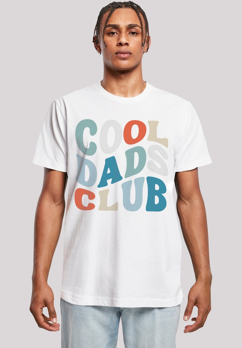 White cotton t-shirt featuring multicolored text reading "COOL DADS CLUB" in varying fonts and sizes. Standard crew neck and short sleeves.