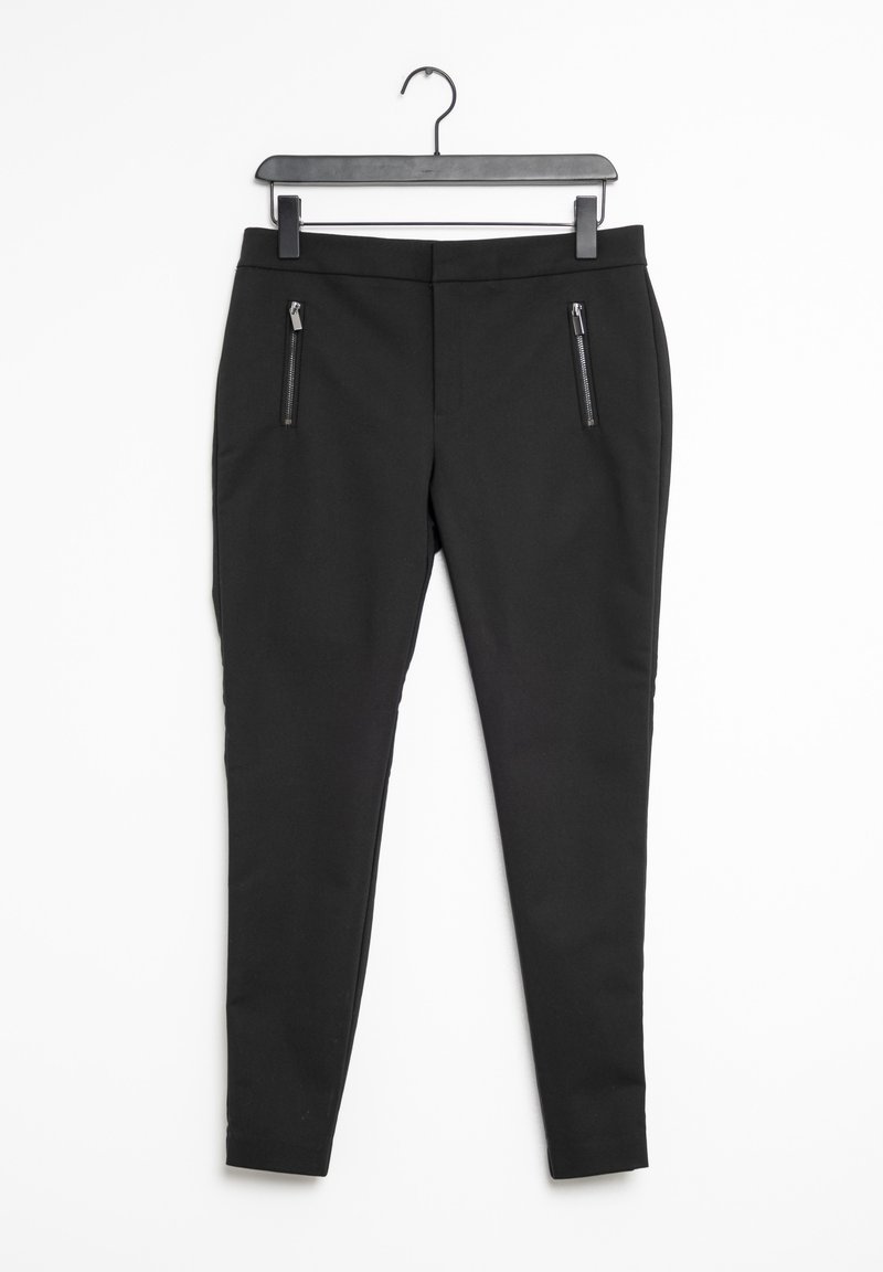 Black pants with a slim fit, featuring elastic material, two zippered pockets, and a smooth texture. Hangs on a black hook.