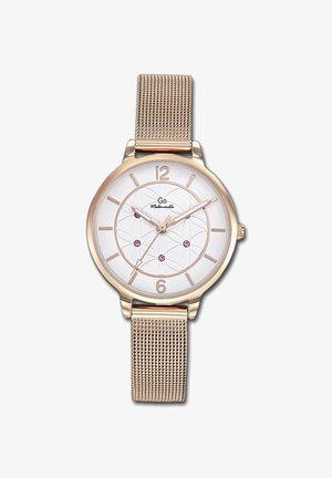 Montre ronde avec un cadran blanc, accents en rose doré, bracelet en maille et des gemmes roses décoratives sur le cadran ; elle présente des marqueurs d'heure minimalistes.