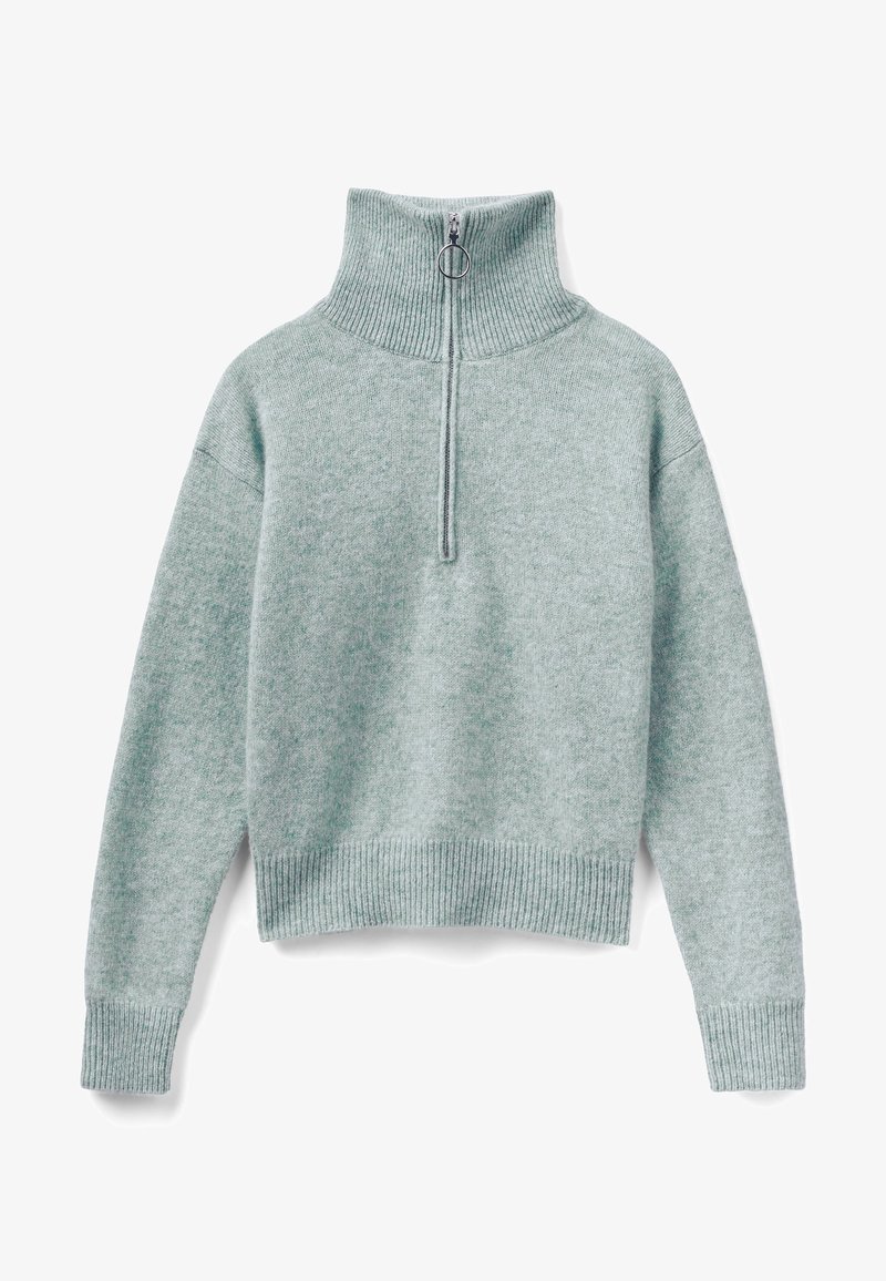 Pull-over tricoté vert clair avec col haut et fermeture à demi-fermeture éclair. Poignets et ourlet côtelés, offrant une texture douce et une coupe décontractée.