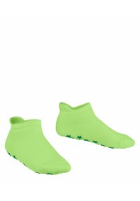Grüne Knöchelsocken mit glatter Textur, die rutschfeste grüne Sternmuster an den Sohlen aufweisen, entworfen für Komfort und Stabilität.