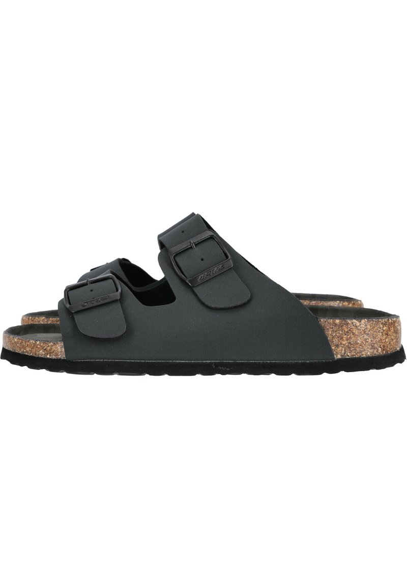 Zwarte rubberen sandalen met twee verstelbare gespen en een kurken voetbed. Voorzien van een getextureerde zwarte zool voor grip en comfort.