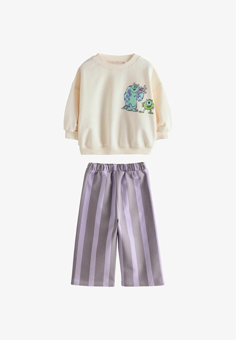 Felpa color crema con maniche a palloncino e grafiche di cartoni, abbinata a pantaloni larghi a righe grigie, con vita elastica.