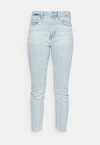 Ljust blå skinny jeans i denim. Hög midja med knäppning, med fransade fållar och två framfickor.
