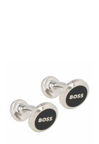 Boutons de manchette en argent avec un centre circulaire en émail noir arborant le texte "BOSS" en blanc. Fini métallique lisse et poli, design moderne.