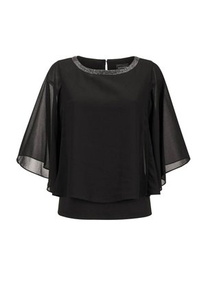 Schwarze Bluse mit durchsichtigen Glockenärmeln und einem runden Halsausschnitt, der mit Strasssteinen verziert ist. Verfügt über einen Reißverschluss auf der Rückseite.