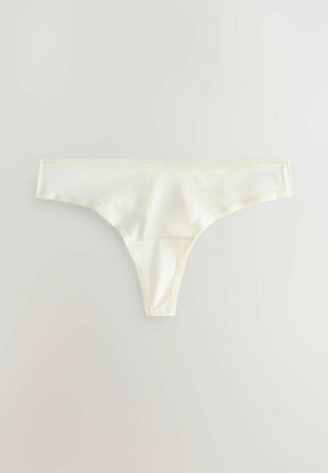 Satin-Tanga in blassgelb mit glatter Textur, minimaler Abdeckung und zarter, gewellter Borte entlang des Taillenbunds.