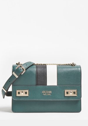 Teal leather Guess handbag with black and white vertical stripes, gold-tone chain strap, buckle, and logo on front flap.