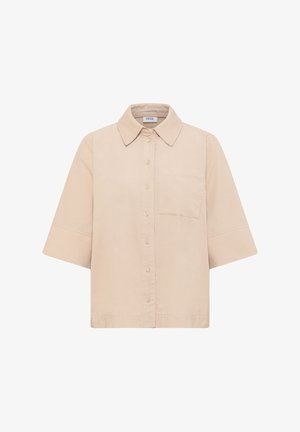 Vaaleanbeige lyhythihainen paita, joka on valmistettu corduroystä. Paidassa on napitettava etuosa, terävä kaulus ja yksi rintatasku. Pehmeä rakenne ja rento istuvuus.