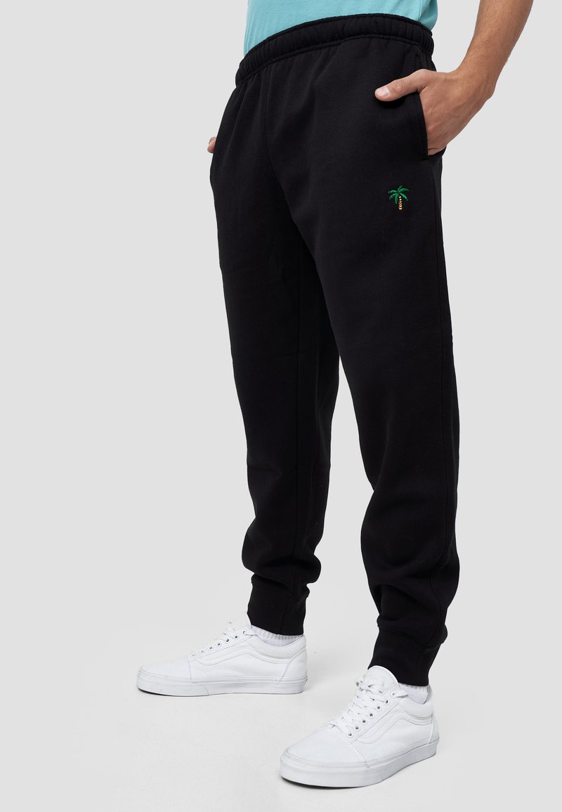 Herren Trainingsanzüge | MIKON PALME Jogginghose schwarz - NE27646 Herren Trainingsanzüge | MIKON PALME Jogginghose schwarz - NE27646