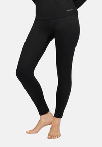 Czarne legginsy wykonane z elastycznego materiału, charakteryzujące się dopasowanym krojem, długością kostki oraz logo marki na pasku.