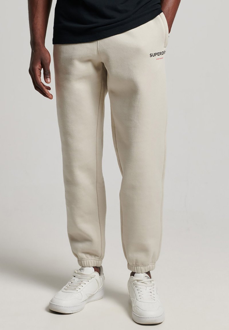 Superdry SPORTSWEAR Tracksuit bottoms pelican beige/beige Zalando