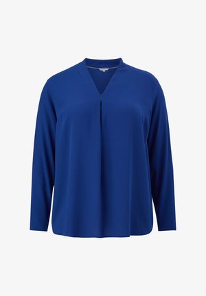 Blouse à manches longues bleu roi avec col en V et pli central à l'avant, présentée sur un fond blanc.