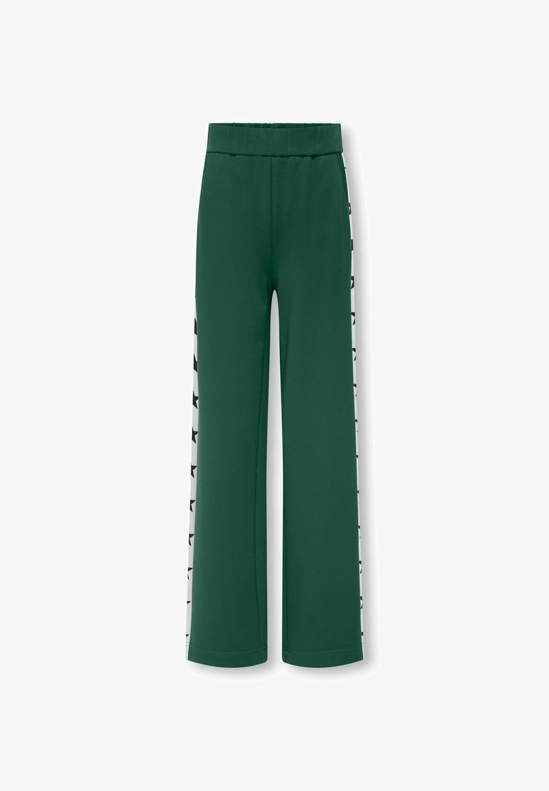 Zaļi platās bikses ar elastīgu jostu, kurām ir melni zvaigžņu raksti uz kontrastējošām baltām sānu svītrām. Izgatavotas no mīksta auduma.