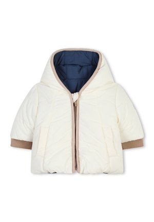 Veste matelassée crème avec capuche, poignets marron et doublure bleue contrastante. Dotée d'une fermeture à l'avant et de poches latérales.