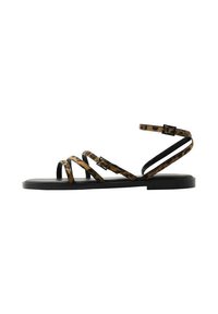 Keen flat sandals with black sole, featuring leopard print straps and buckle closures. Lightweight design with a minimalist silhouette.