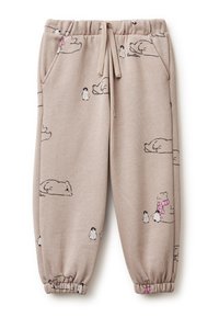 Beige tepláky s elastickým pasem, zdobené černými kreslenými medvědy a tučňáky v různých pózách. Manžety mají těsný střih.