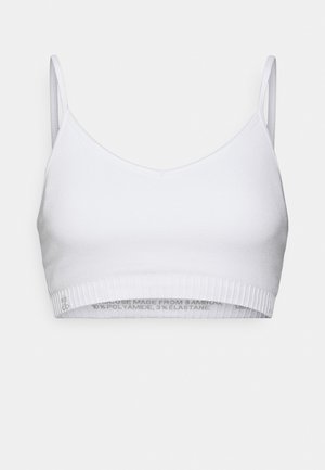 Hvitt bralette laget av bambus, polyamid og elastan. Har en ribbestrikket kant og tynne justerbare stropper. Enkelt, sømløst design.