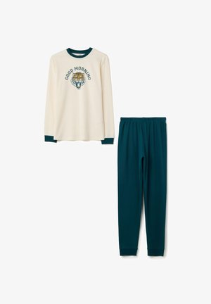 Haut à manches longues crème avec le message "BONJOUR" et un graphique de tigre, assorti à un ensemble de pyjama avec un pantalon élastique à taille verte foncée.
